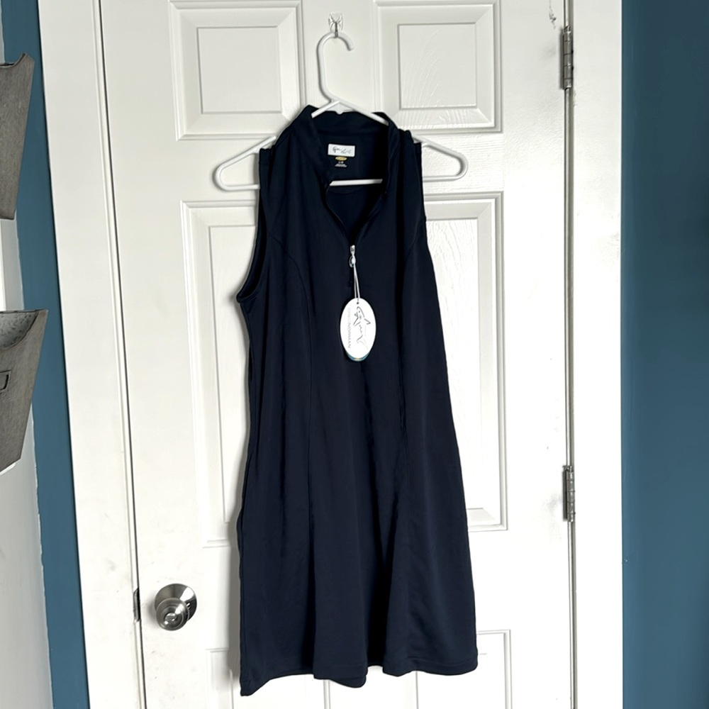 Greg, Norman golf dress. Size large. Navy blue. With pockets.NWT